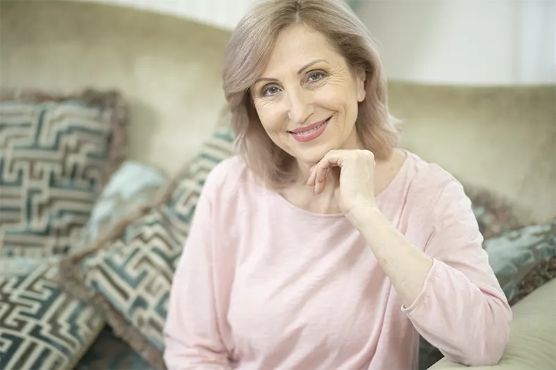 attractive-middle-aged-woman-relaxing-home-sitting-sofa2